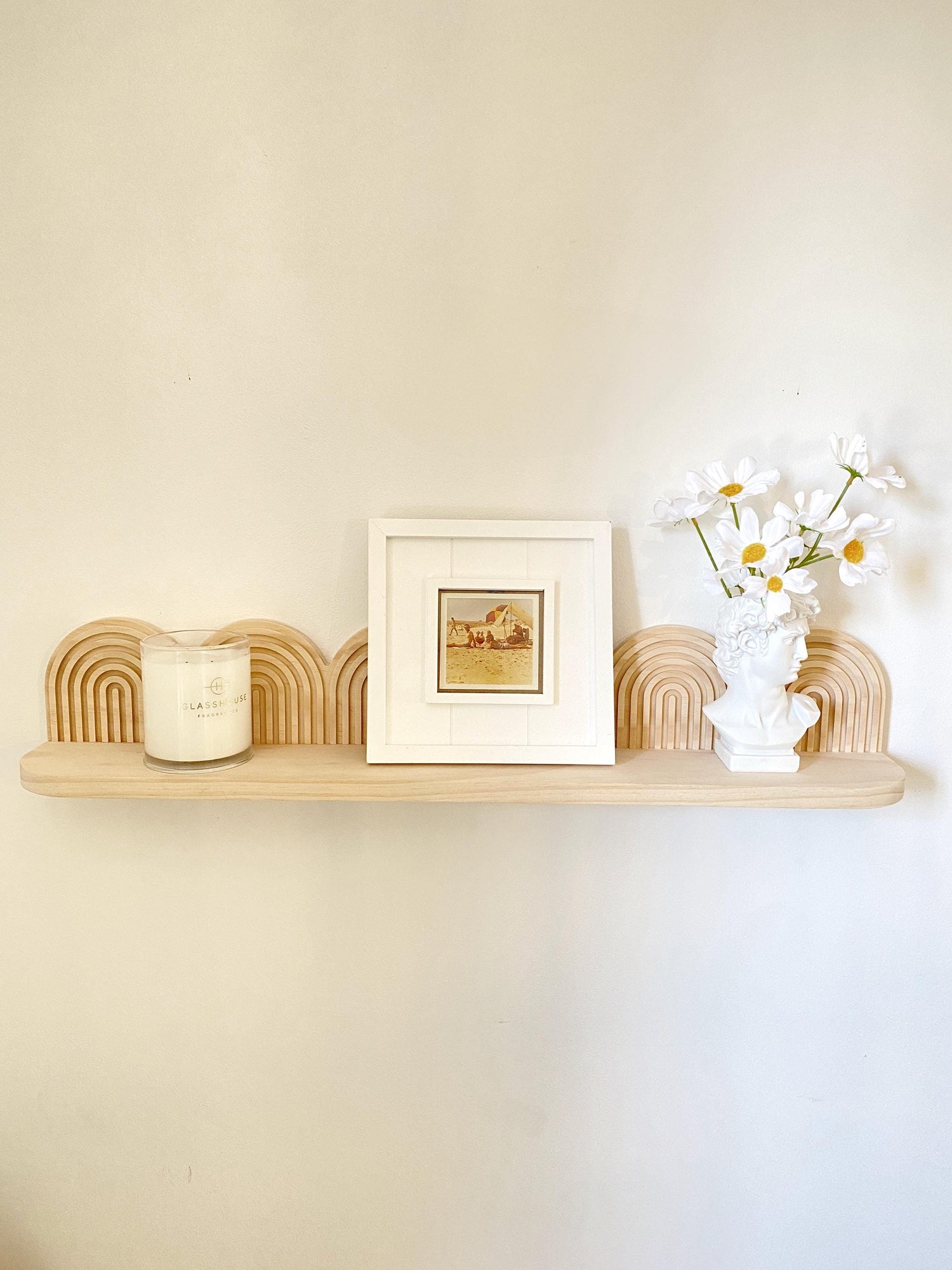 &quot;Handmade wooden floating shelf with arched layered backplate, crafted from light natural wood. Aesthetic mid-century modern and art deco-inspired wall-mounted shelf, styled with a candle, framed artwork, and a floral bust vase. Ideal for minimalist, boho, or contemporary home decor.